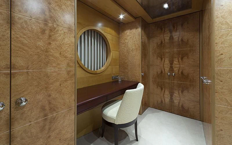 a bathroom with a mirror and a chair aboard SARAH Yacht for Sale