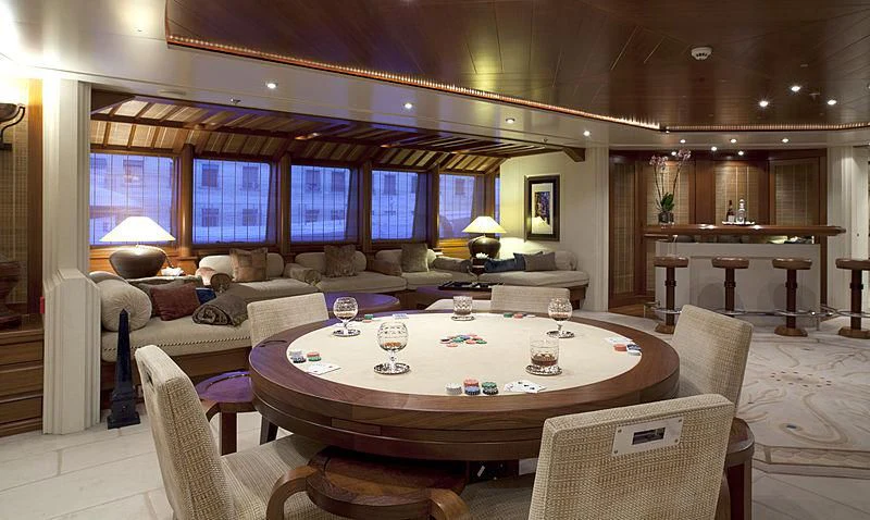 a large living room with a large table and chairs aboard SARAH Yacht for Sale
