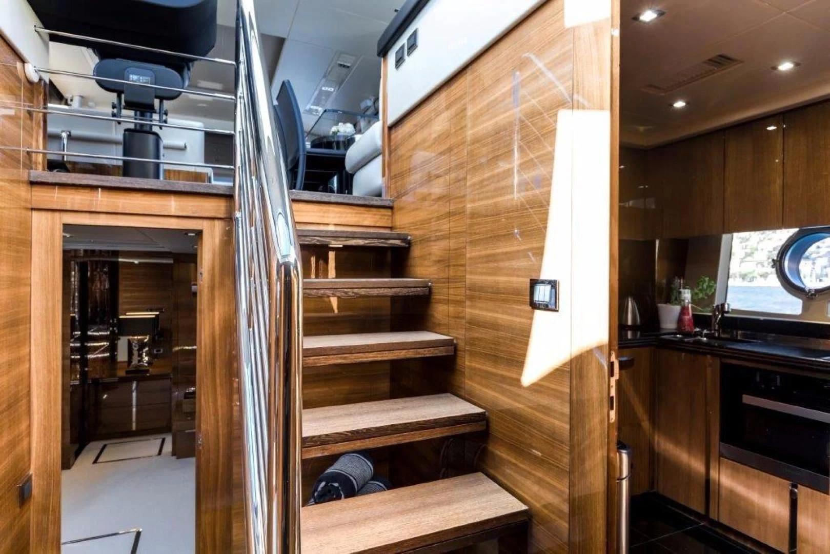 a wooden staircase in a house aboard YINWA Yacht for Sale