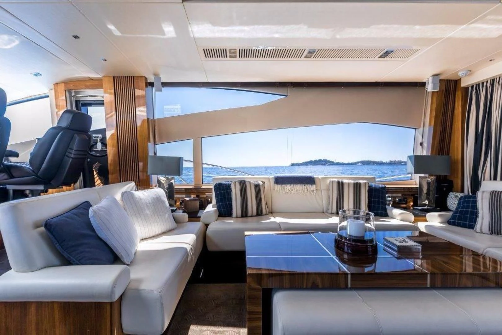 a room with a table chairs and a large window aboard YINWA Yacht for Sale