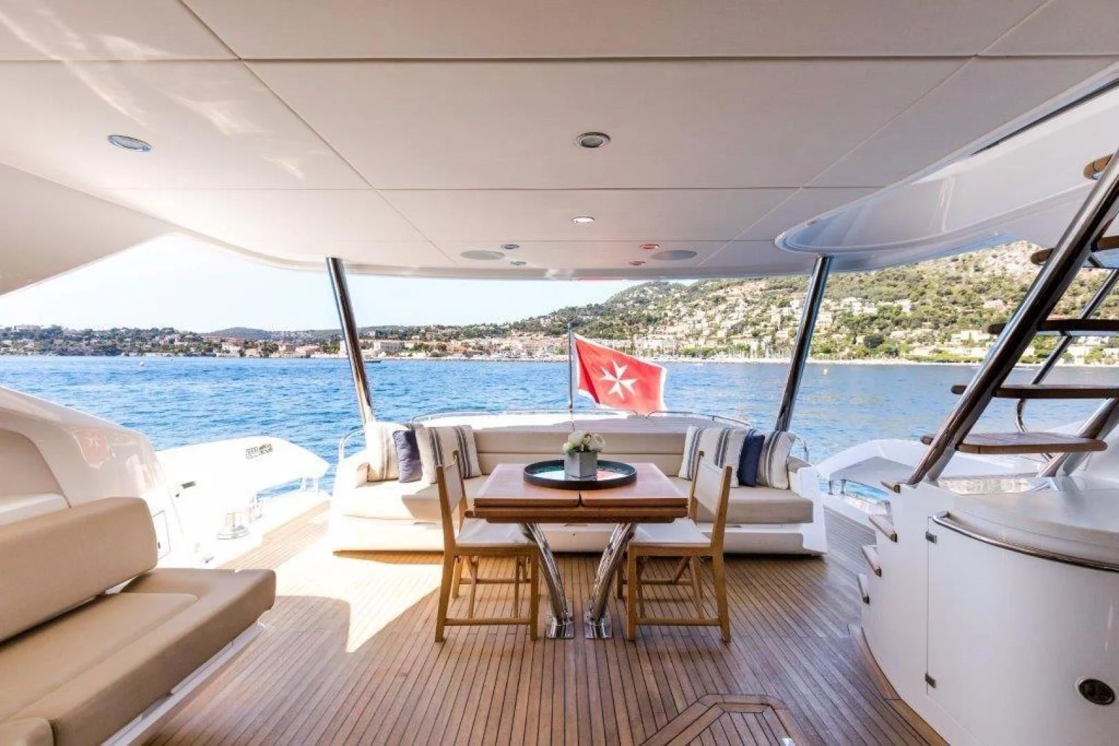 a table and chairs on a boat aboard YINWA Yacht for Sale