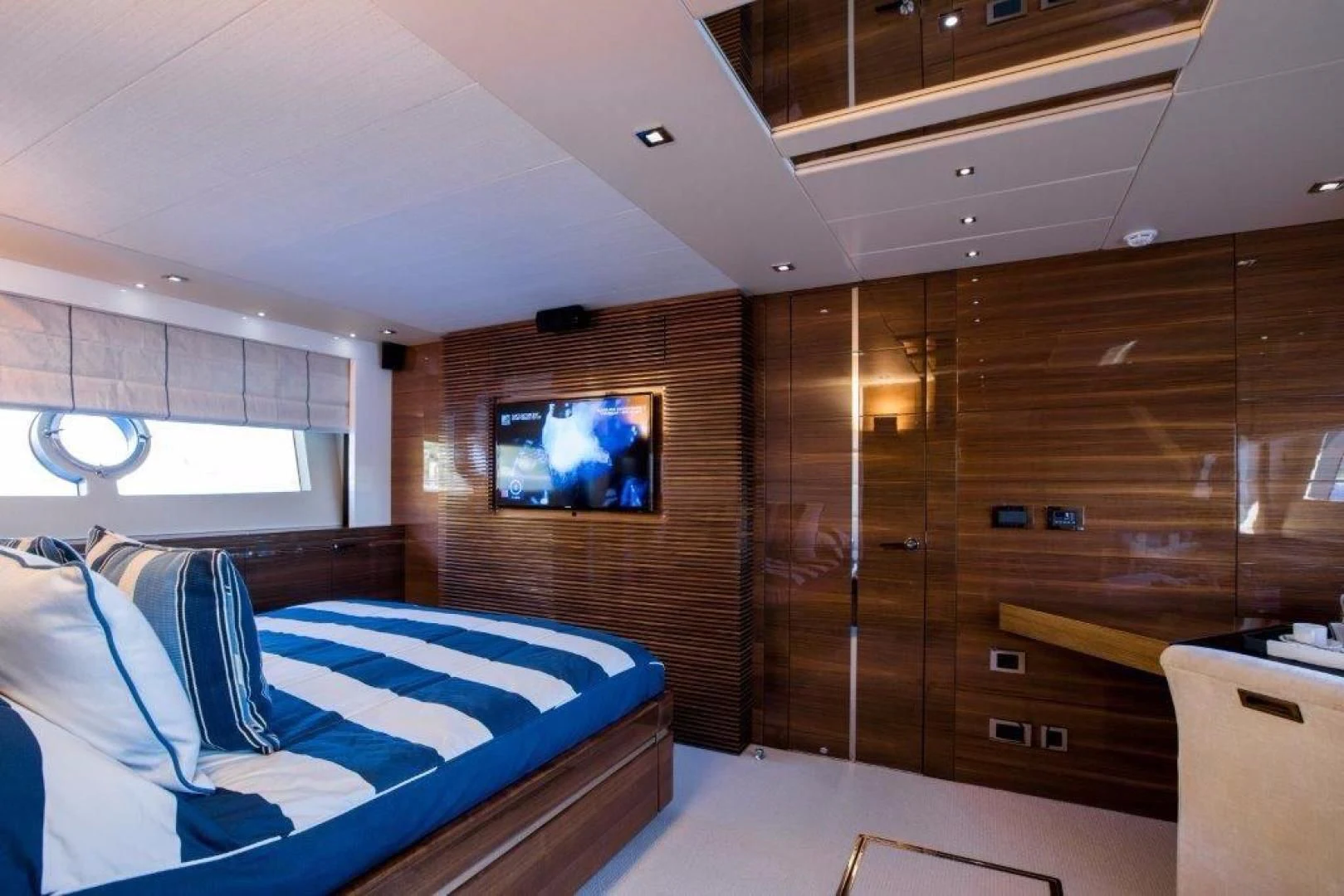 a room with a bed and a tv aboard YINWA Yacht for Sale