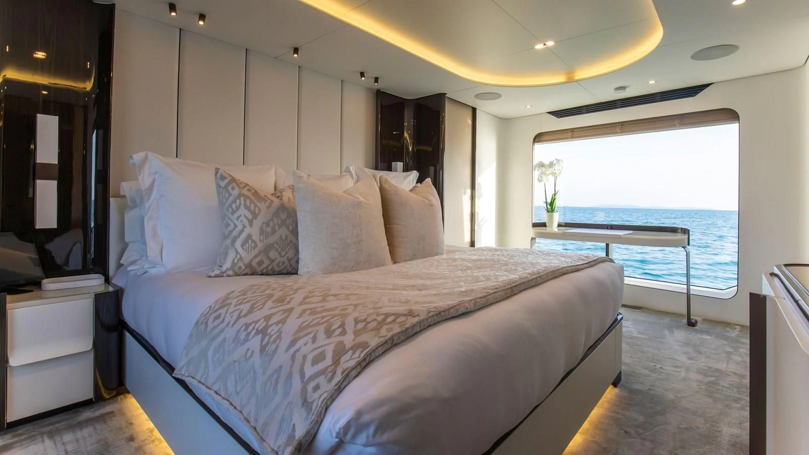 a bed with white sheets aboard AZIMUT GRANDE 32M Yacht for Sale