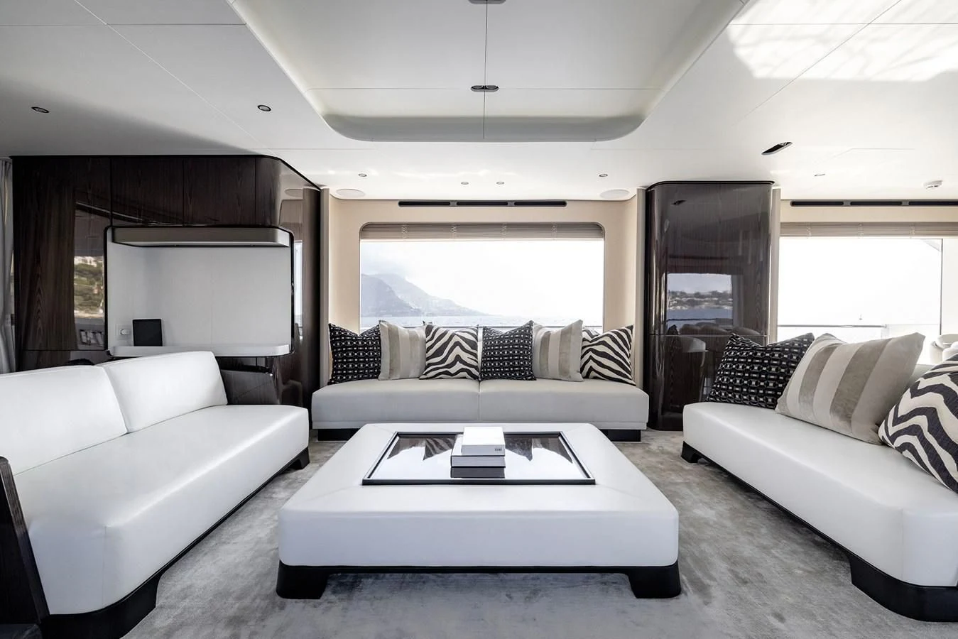 a living room with a couch and a coffee table aboard AZIMUT GRANDE 32M Yacht for Sale