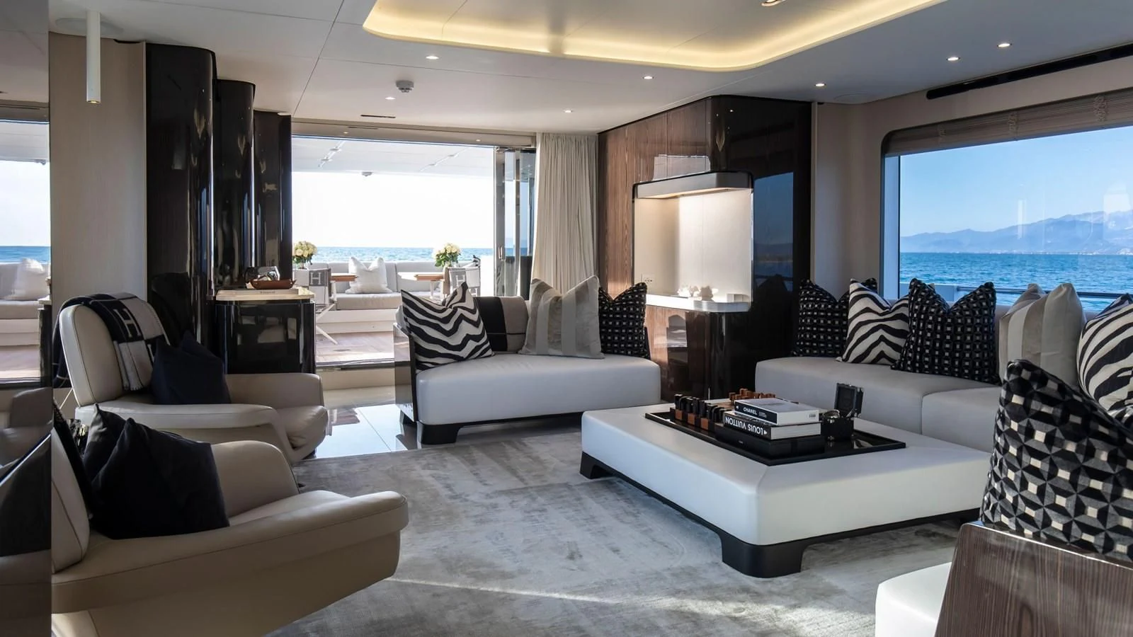 a living room with a large window aboard AZIMUT GRANDE 32M Yacht for Sale