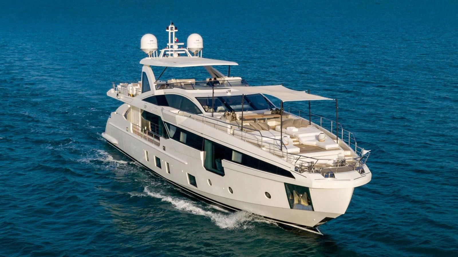 a white yacht on the water aboard AZIMUT GRANDE 32M Yacht for Sale