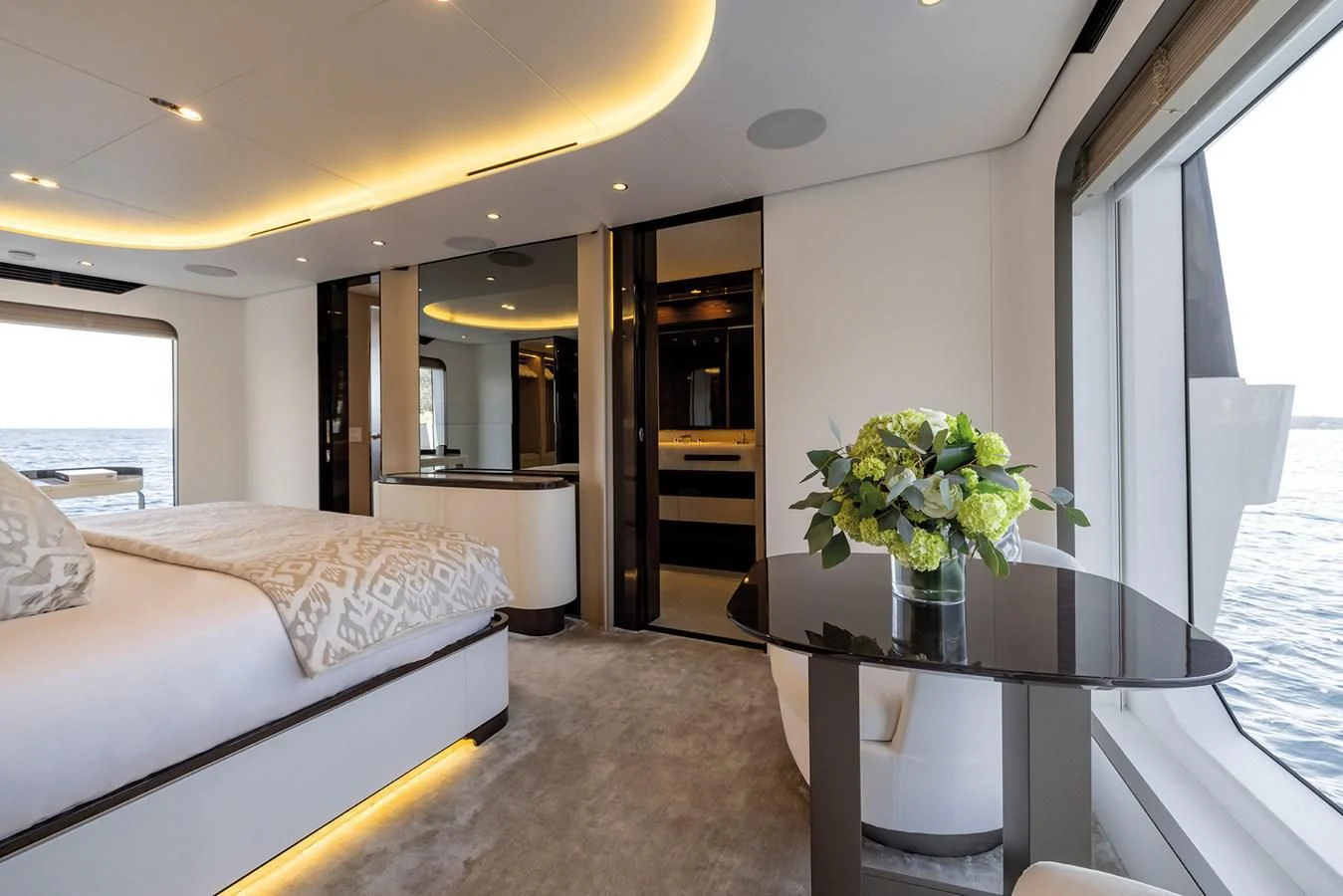 a hotel room with a bed and a table aboard AZIMUT GRANDE 32M Yacht for Sale