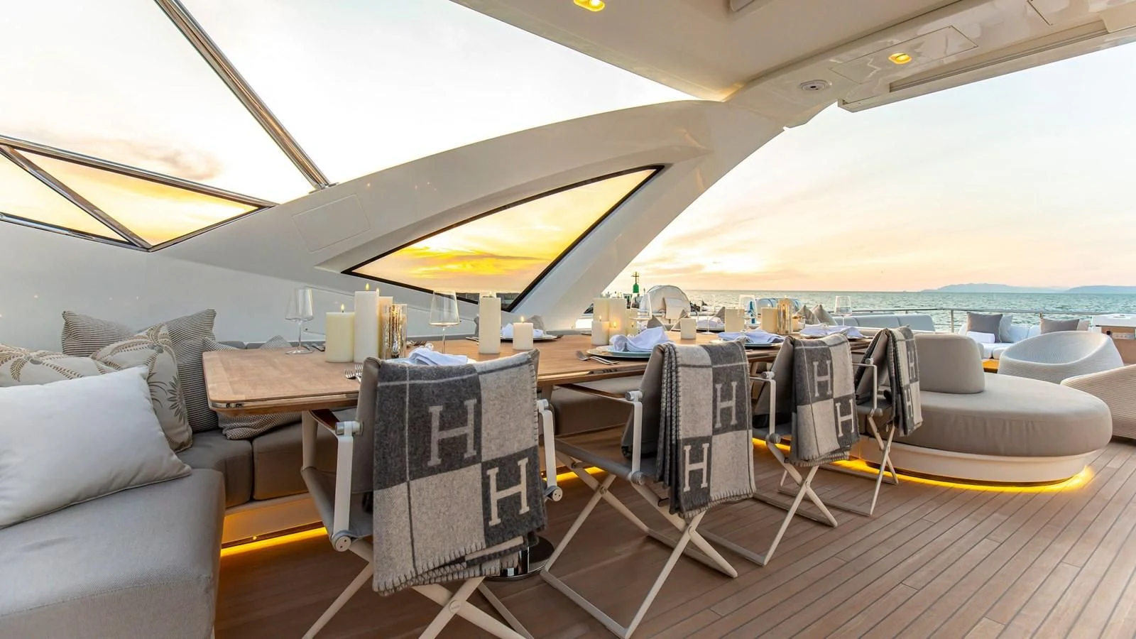 a room with a table and chairs aboard AZIMUT GRANDE 32M Yacht for Sale