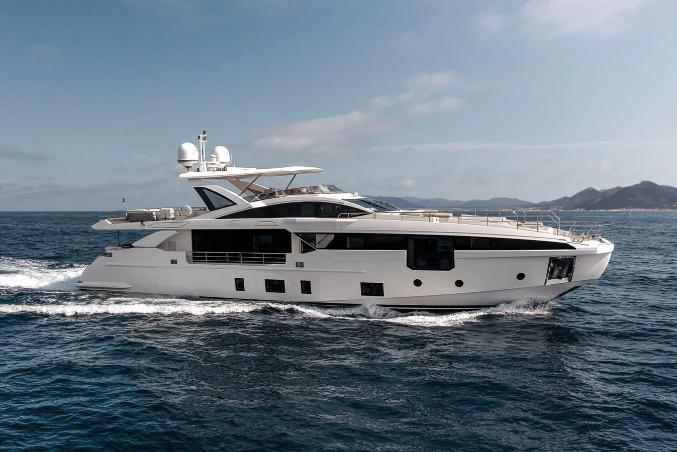 a white yacht on the water aboard AZIMUT GRANDE 32M Yacht for Sale