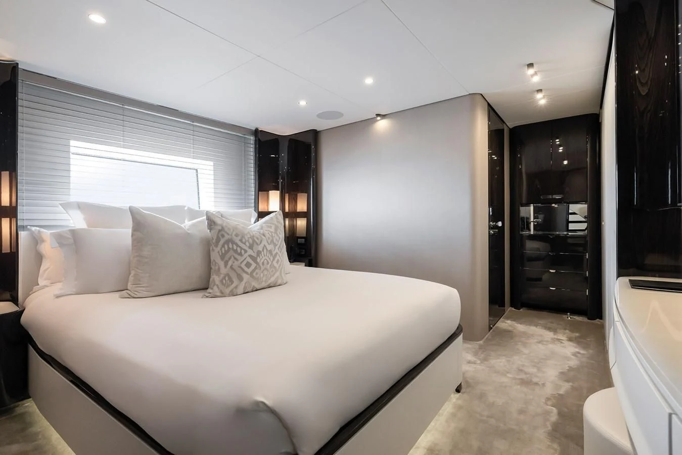 a large bed in a hotel room aboard AZIMUT GRANDE 32M Yacht for Sale
