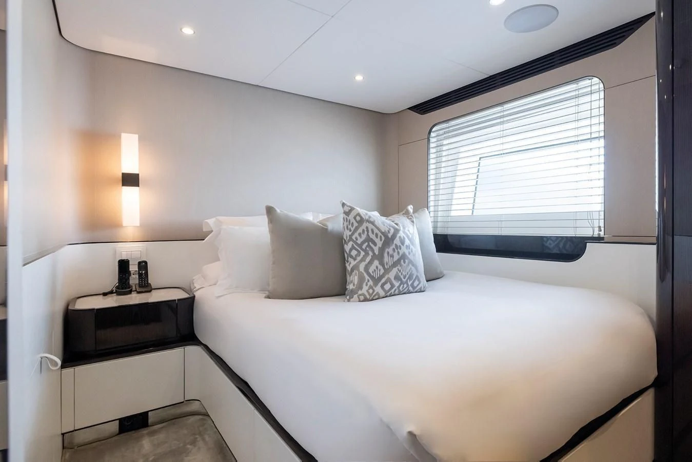 a bed with a white bed spread aboard AZIMUT GRANDE 32M Yacht for Sale