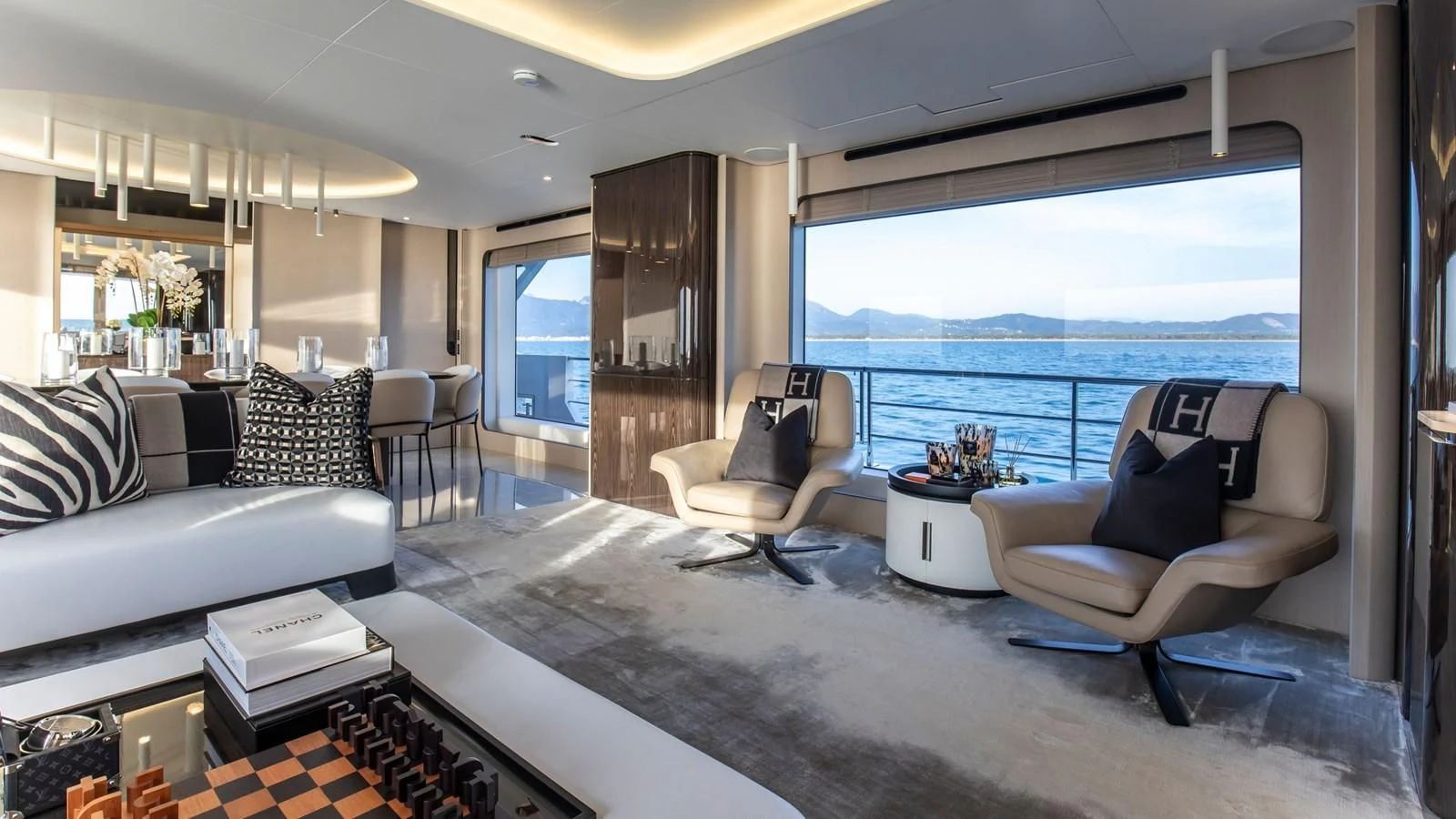 a living room with a large window aboard AZIMUT GRANDE 32M Yacht for Sale
