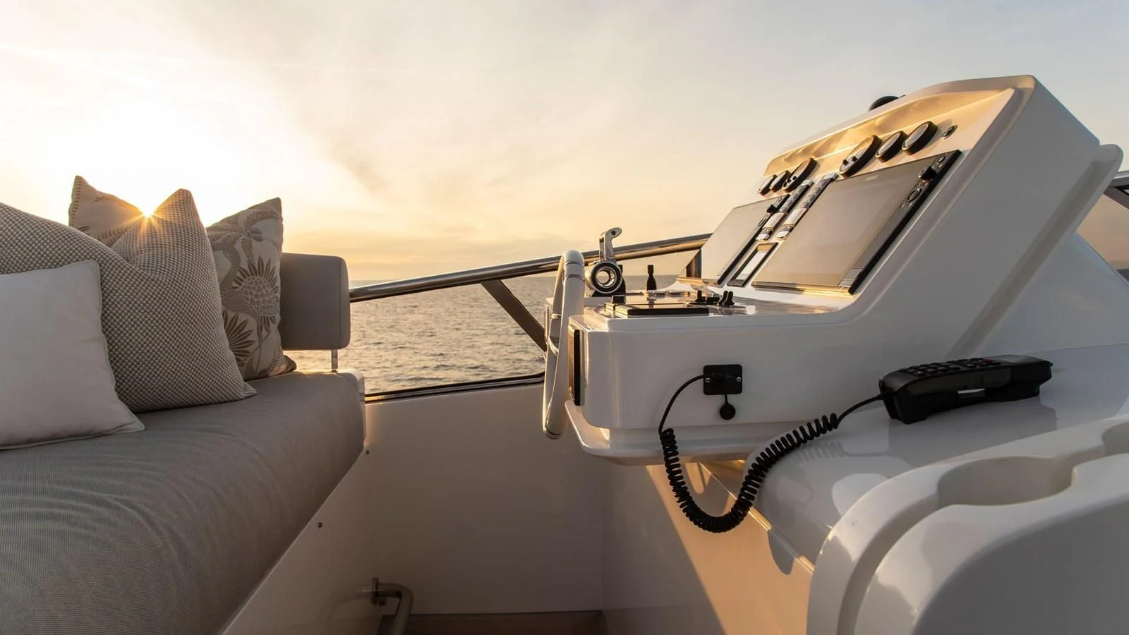 a white car with a steering wheel aboard AZIMUT GRANDE 32M Yacht for Sale