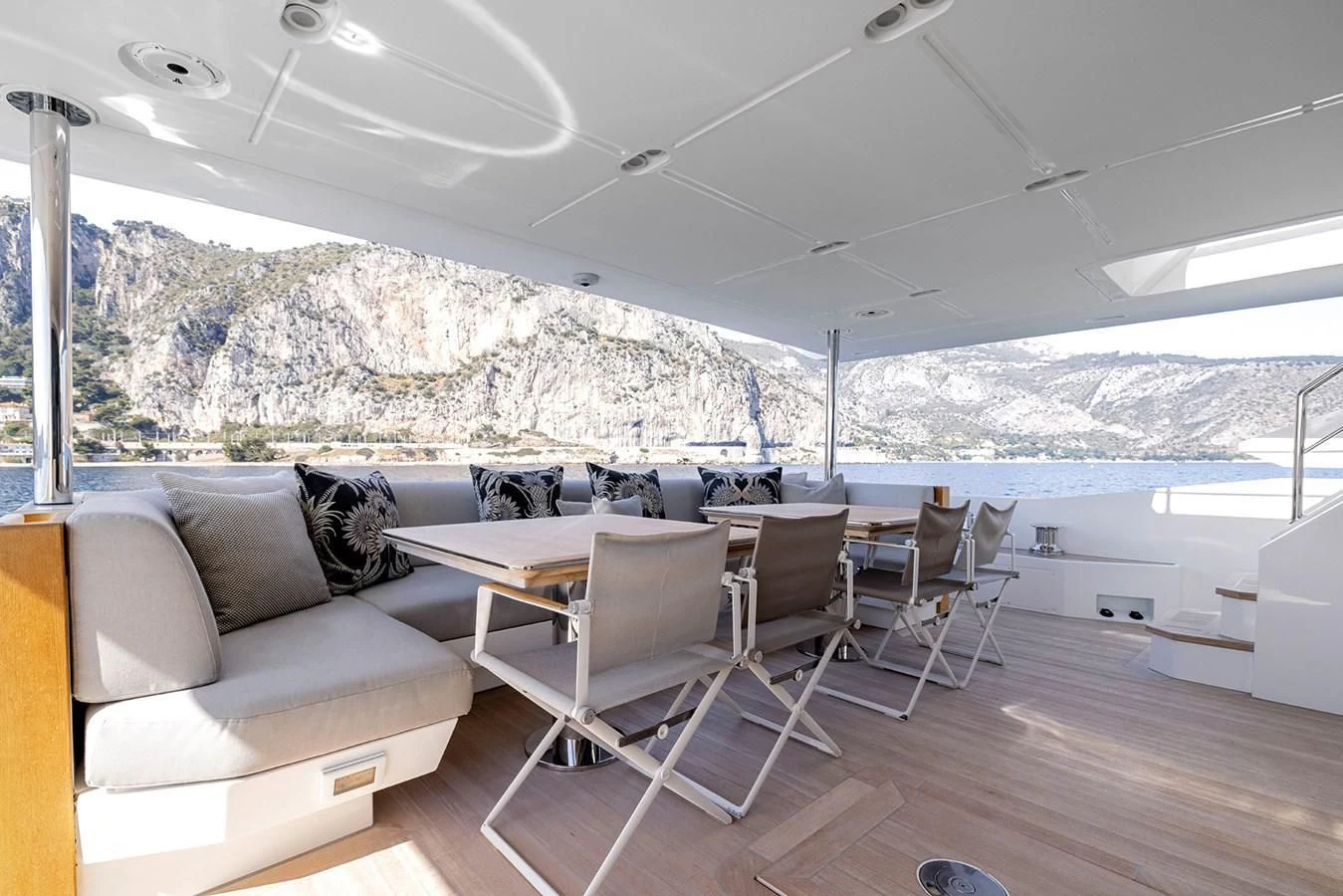 a room with a couch and a table and chairs aboard AZIMUT GRANDE 32M Yacht for Sale