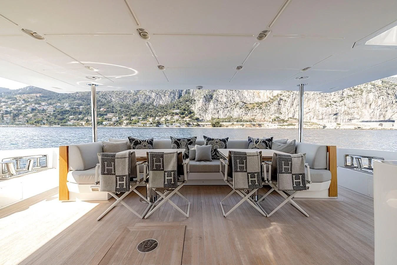 a room with a table and chairs aboard AZIMUT GRANDE 32M Yacht for Sale