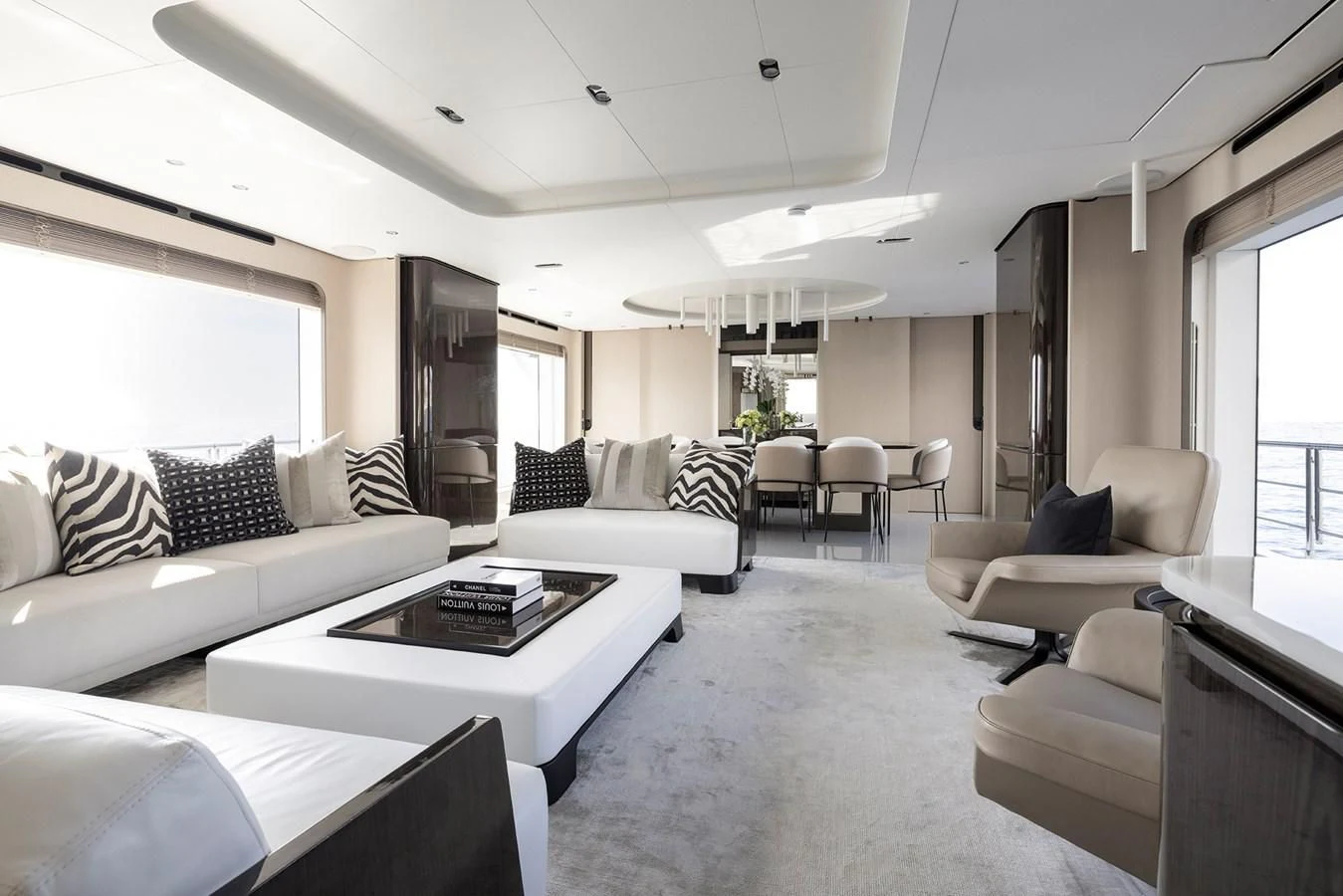 a living room with white furniture aboard AZIMUT GRANDE 32M Yacht for Sale