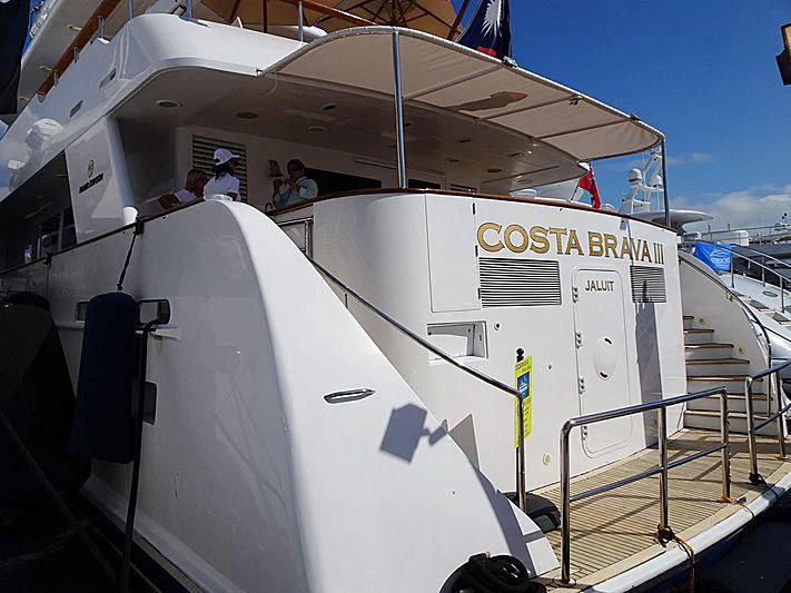 a large white airplane with people on the door aboard COSTA BRAVA III Yacht for Sale