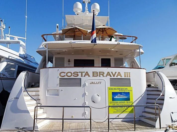 a large white boat with a blue roof aboard COSTA BRAVA III Yacht for Sale