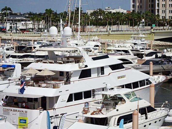 a group of boats are parked in a harbor aboard COSTA BRAVA III Yacht for Sale
