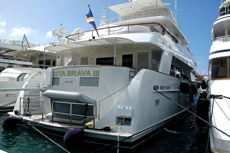 a boat docked at a pier aboard COSTA BRAVA III Yacht for Sale