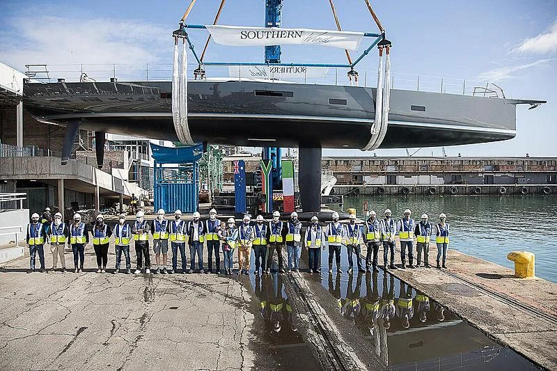 a group of people in uniform standing in front of a building aboard AMMONITE Yacht for Sale
