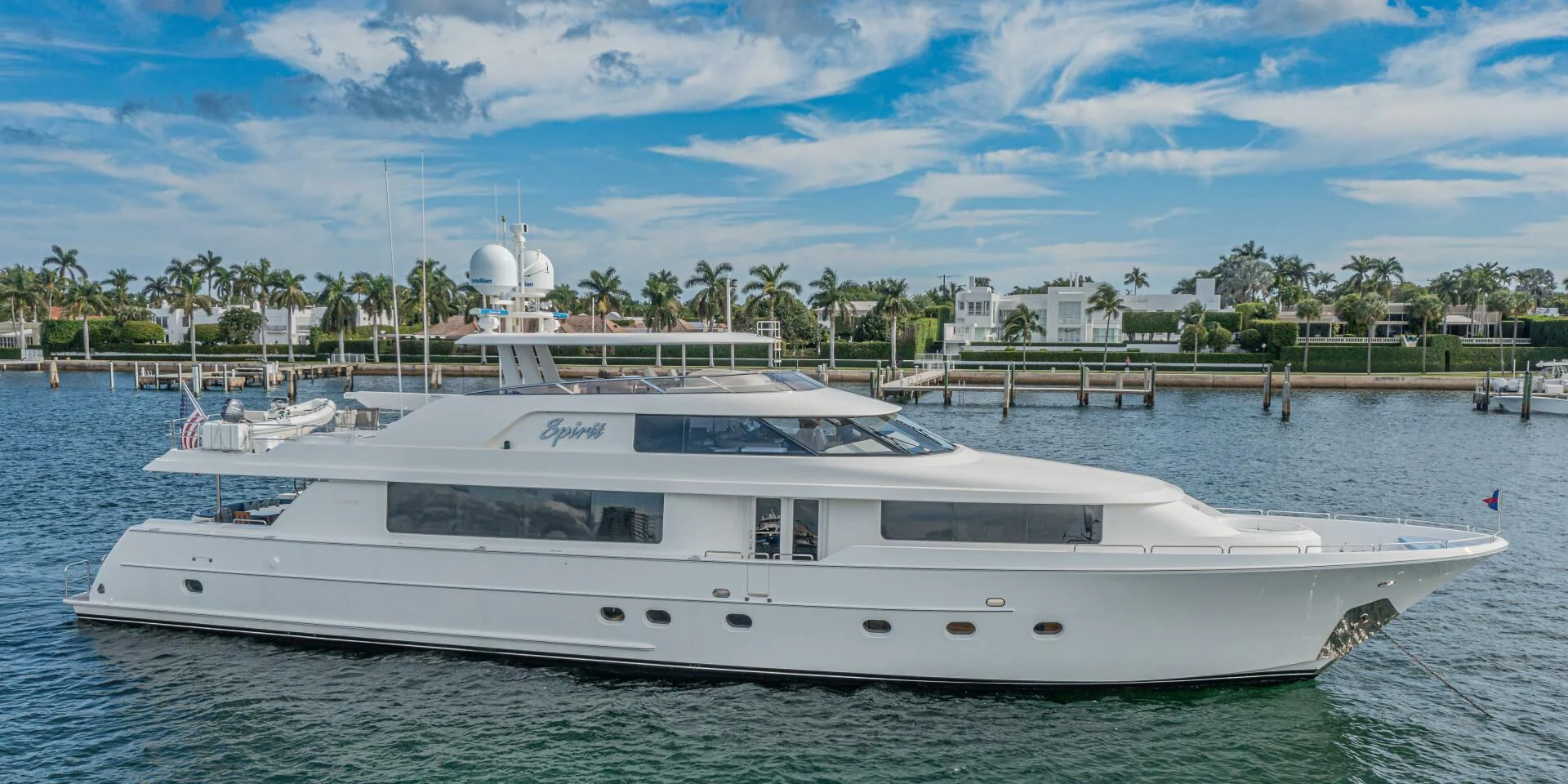 a white yacht on the water aboard LIBERTAS Yacht for Sale