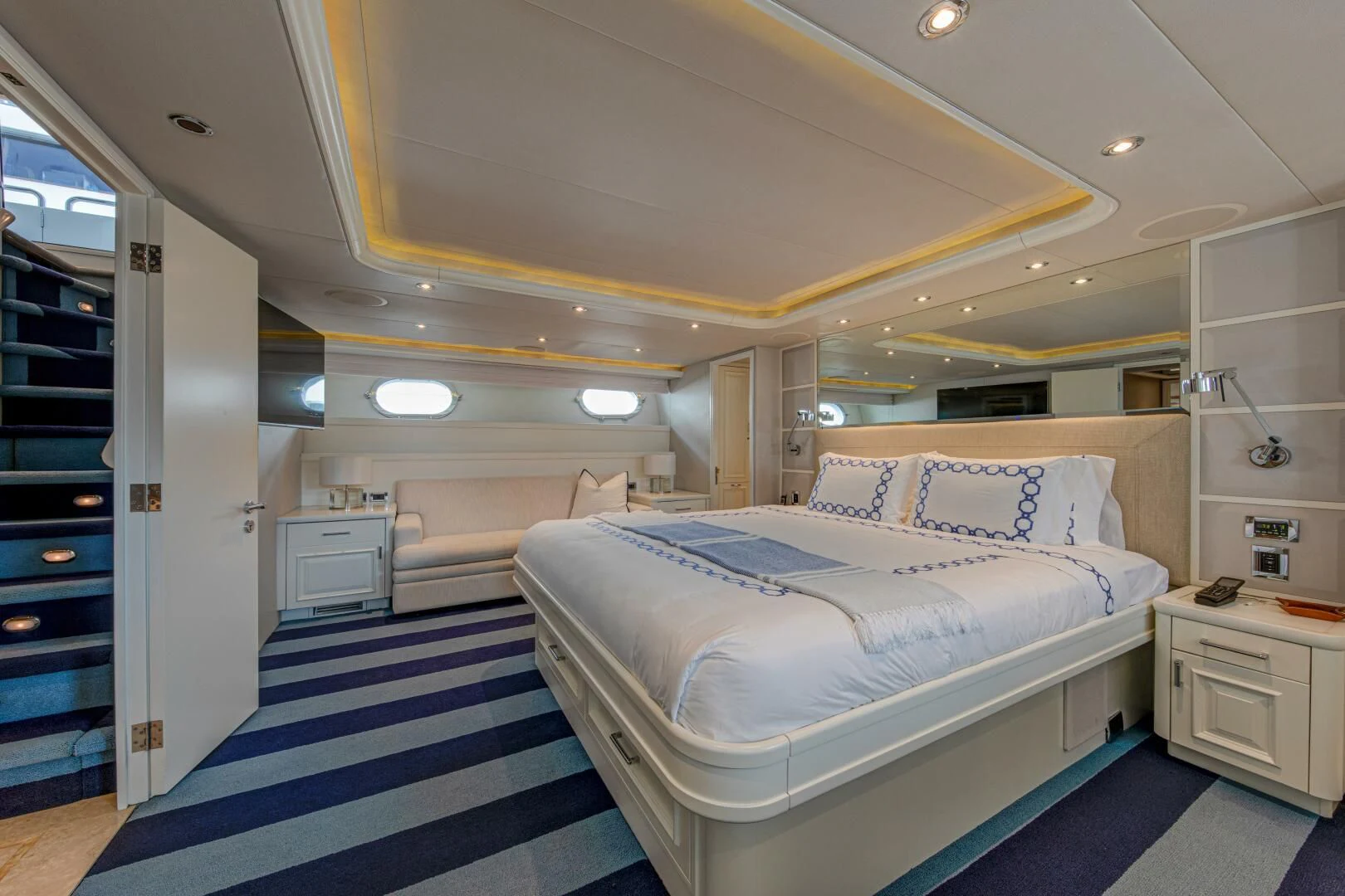 a room with a couple of beds aboard LIBERTAS Yacht for Sale