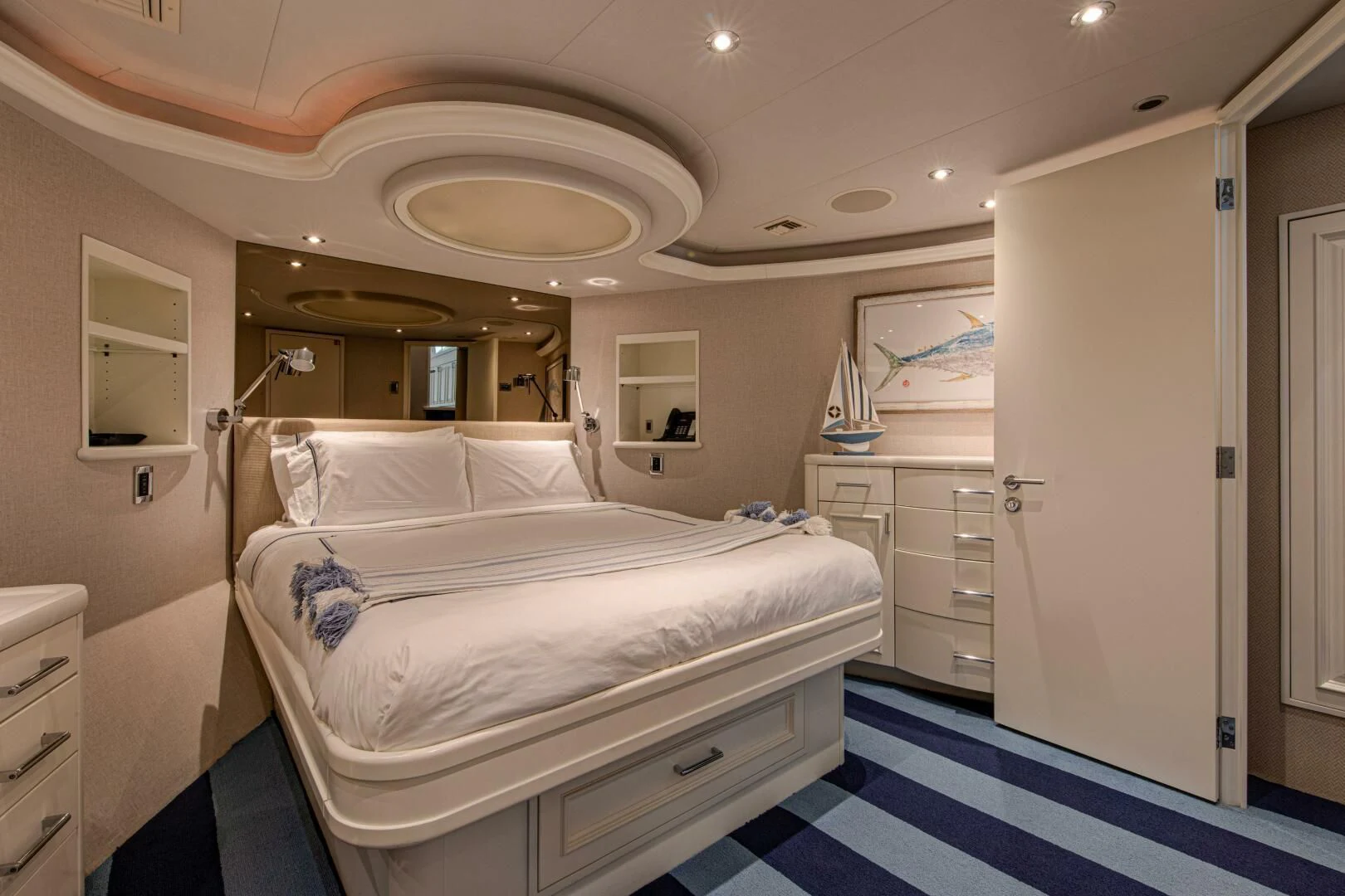 a large white bed in a room aboard LIBERTAS Yacht for Sale