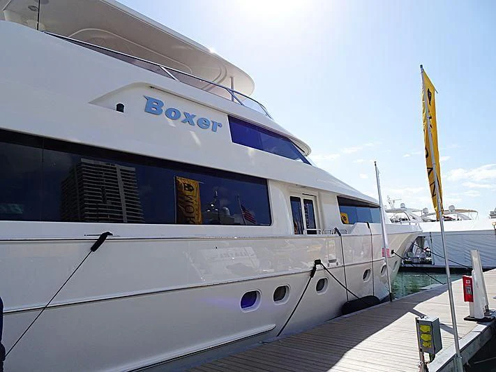 a boat docked at a pier aboard LIBERTAS Yacht for Sale