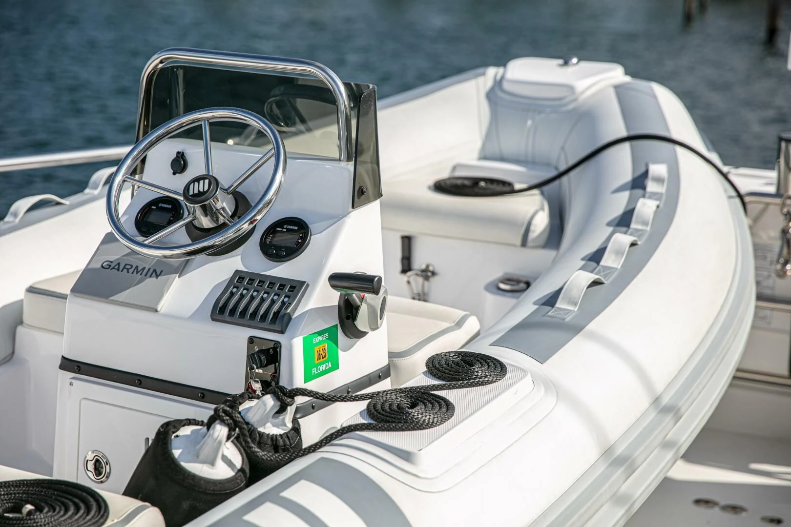 a white car with a steering wheel aboard LIBERTAS Yacht for Sale