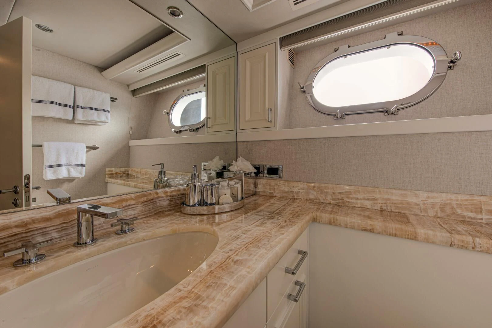 a bathroom with a large window aboard LIBERTAS Yacht for Sale