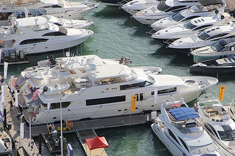 a group of boats are parked in a harbor aboard LIBERTAS Yacht for Sale