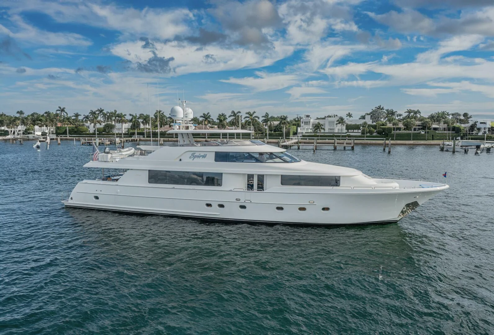 a white boat in the water aboard LIBERTAS Yacht for Sale