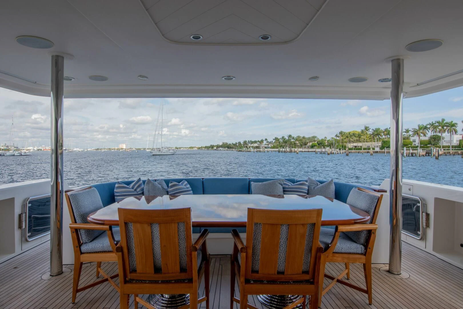 a table and chairs on a deck aboard LIBERTAS Yacht for Sale