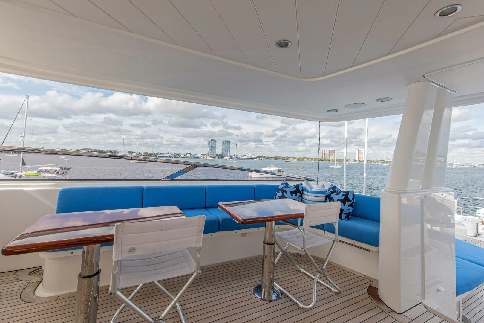a room with a table and chairs aboard LIBERTAS Yacht for Sale