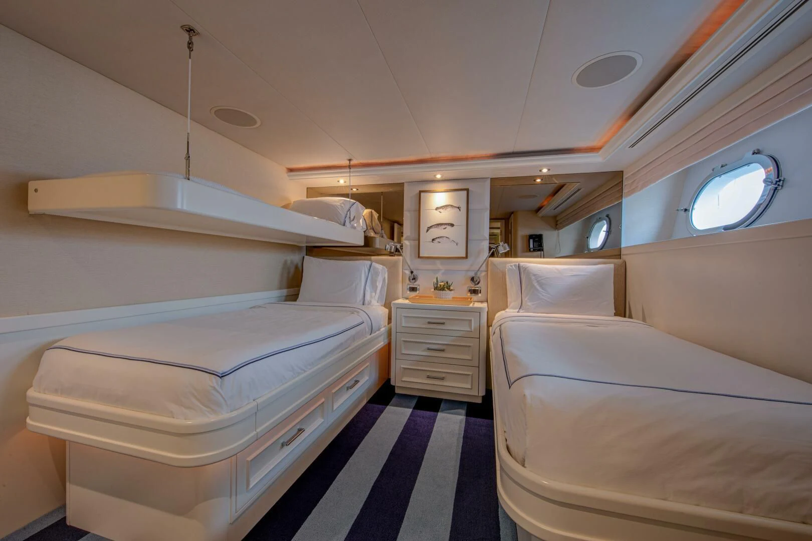 a room with beds and a window aboard LIBERTAS Yacht for Sale