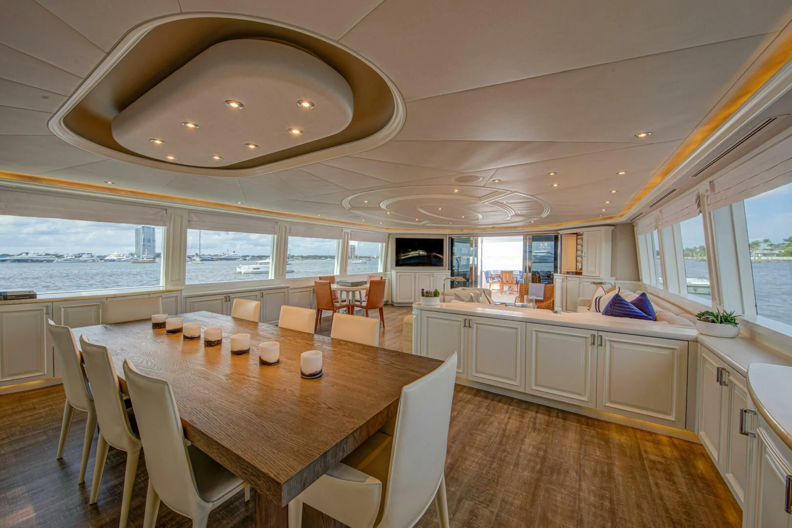 a large kitchen with a dining table aboard LIBERTAS Yacht for Sale