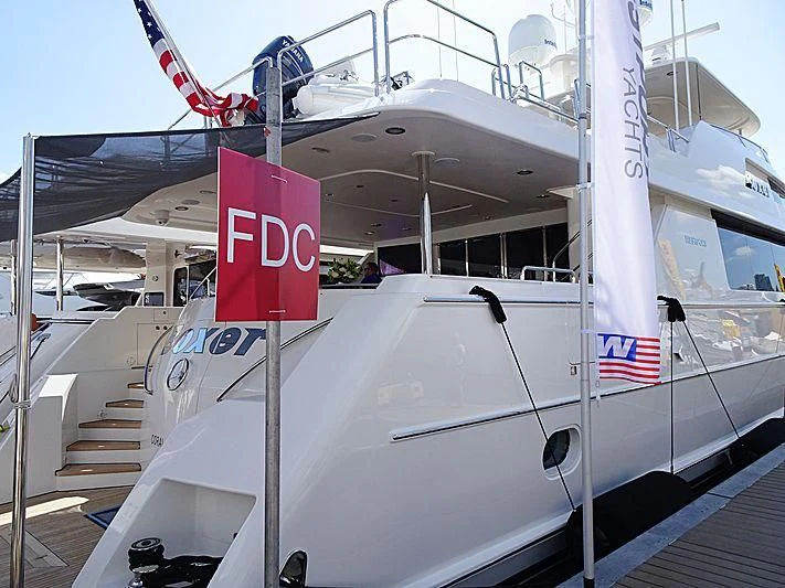 a boat with a sign on the front aboard LIBERTAS Yacht for Sale
