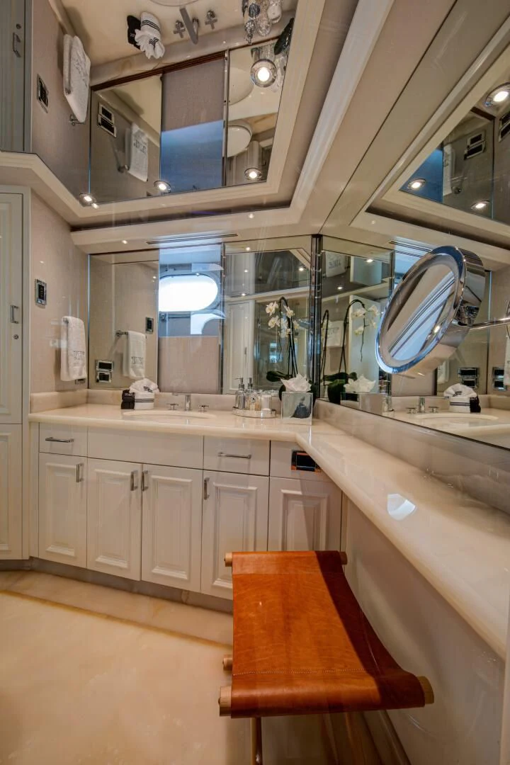 a bathroom with a large mirror aboard LIBERTAS Yacht for Sale