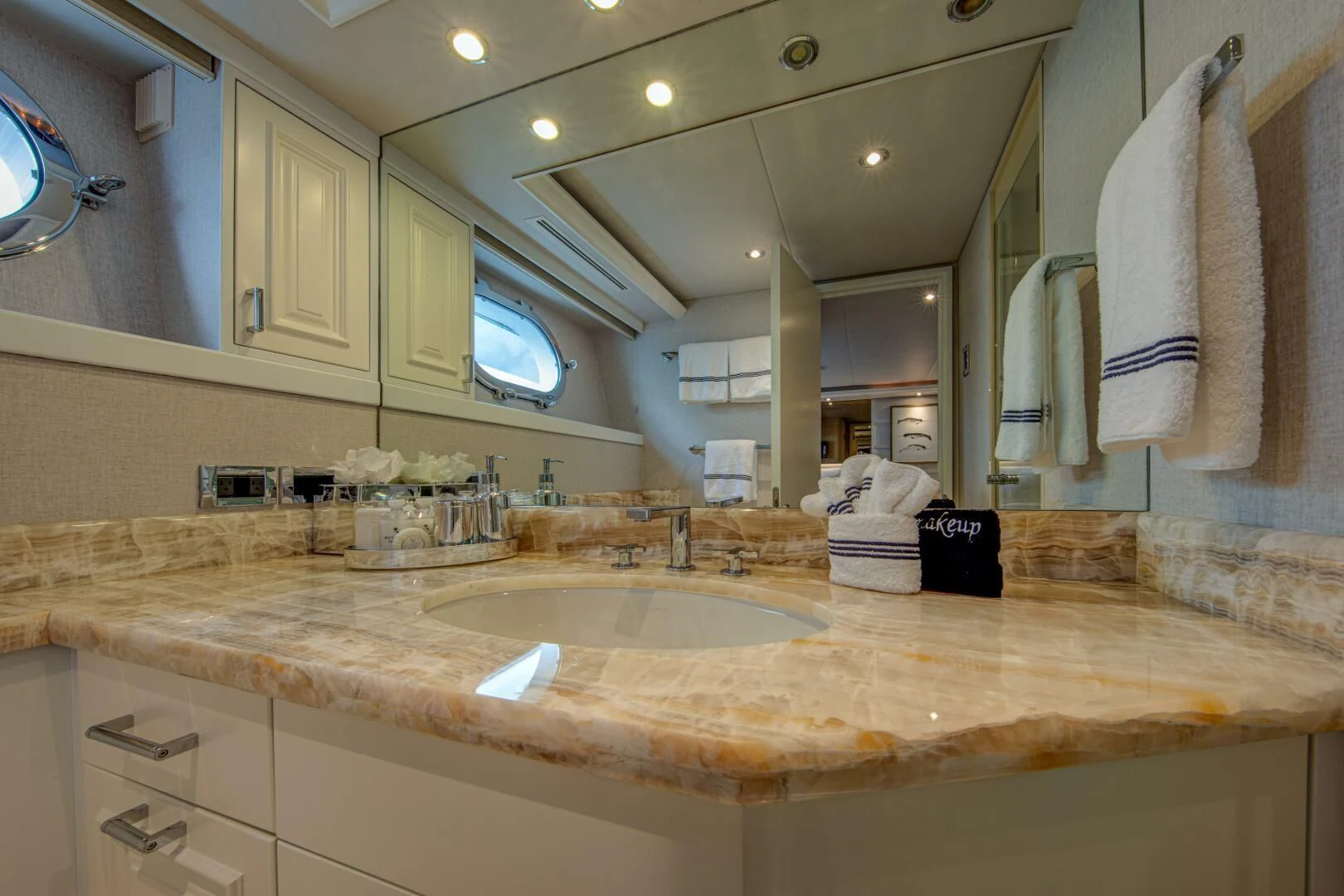 a bathroom with a large mirror aboard LIBERTAS Yacht for Sale