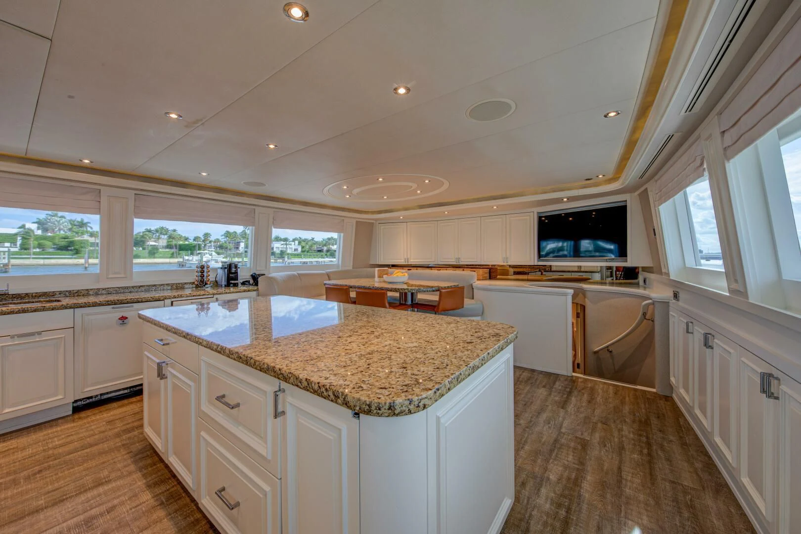 a kitchen with white cabinets aboard LIBERTAS Yacht for Sale