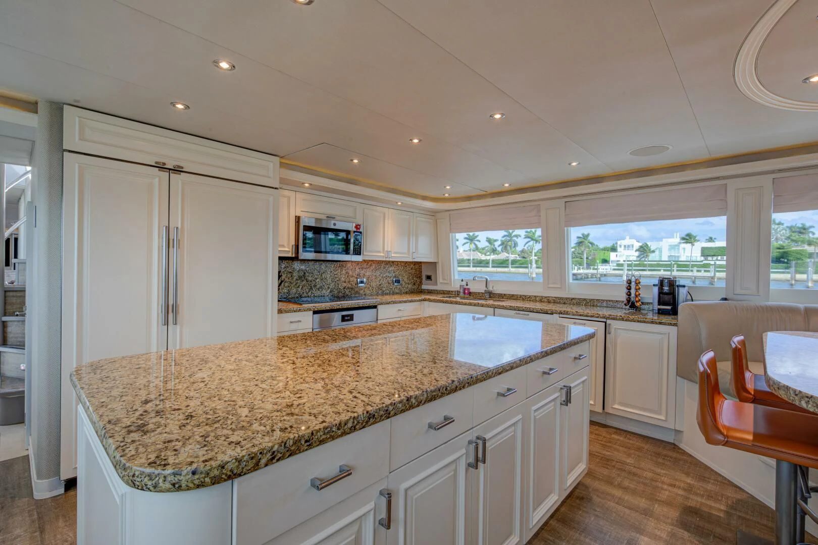 a kitchen with a marble counter top aboard LIBERTAS Yacht for Sale