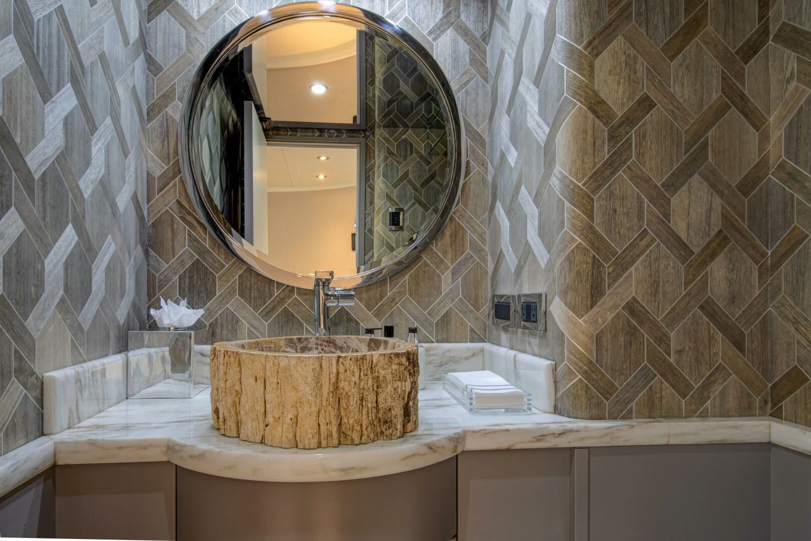 a bathroom with a round mirror aboard LIBERTAS Yacht for Sale
