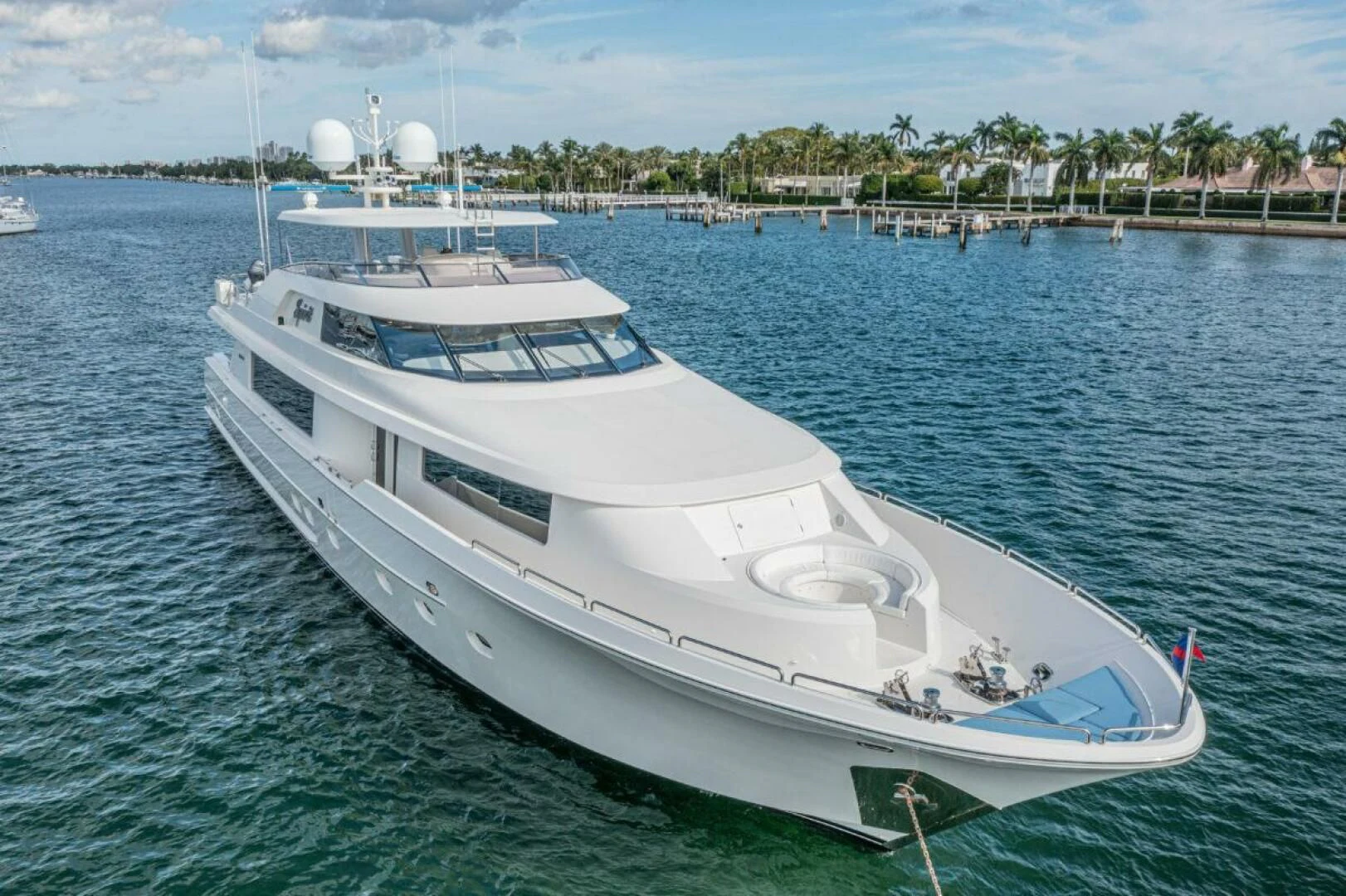 a white boat in the water aboard LIBERTAS Yacht for Sale