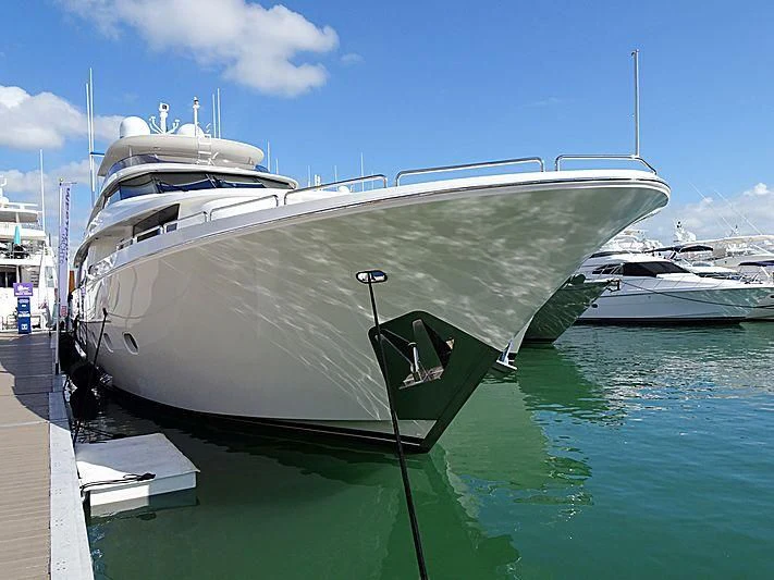 a boat docked at a pier aboard LIBERTAS Yacht for Sale