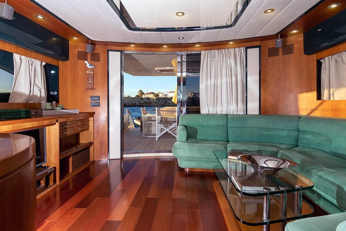 a living room with a couch and a table aboard MACAMI Yacht for Sale