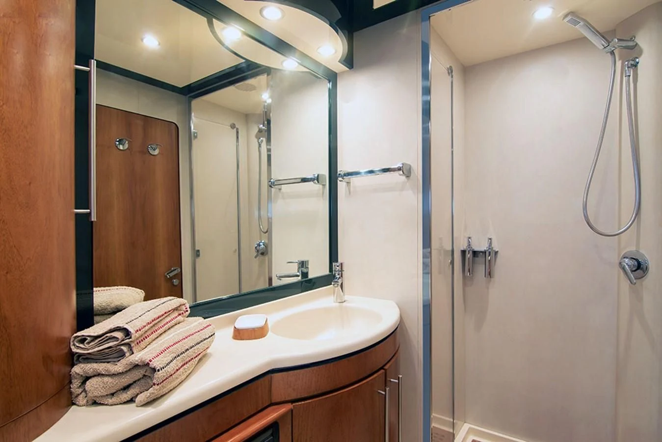 a bathroom with a large mirror aboard MACAMI Yacht for Sale