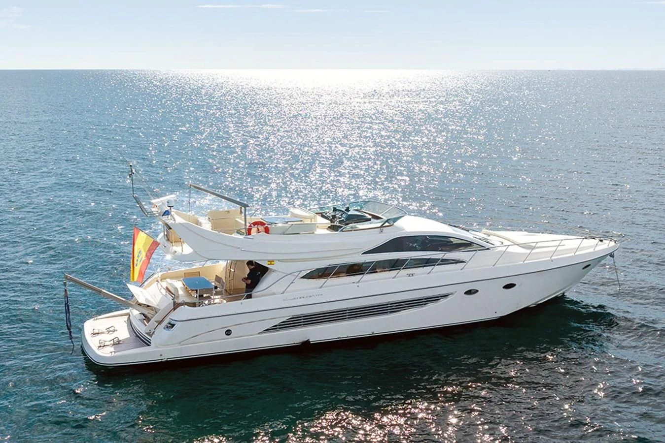 a white yacht on the water aboard MACAMI Yacht for Sale