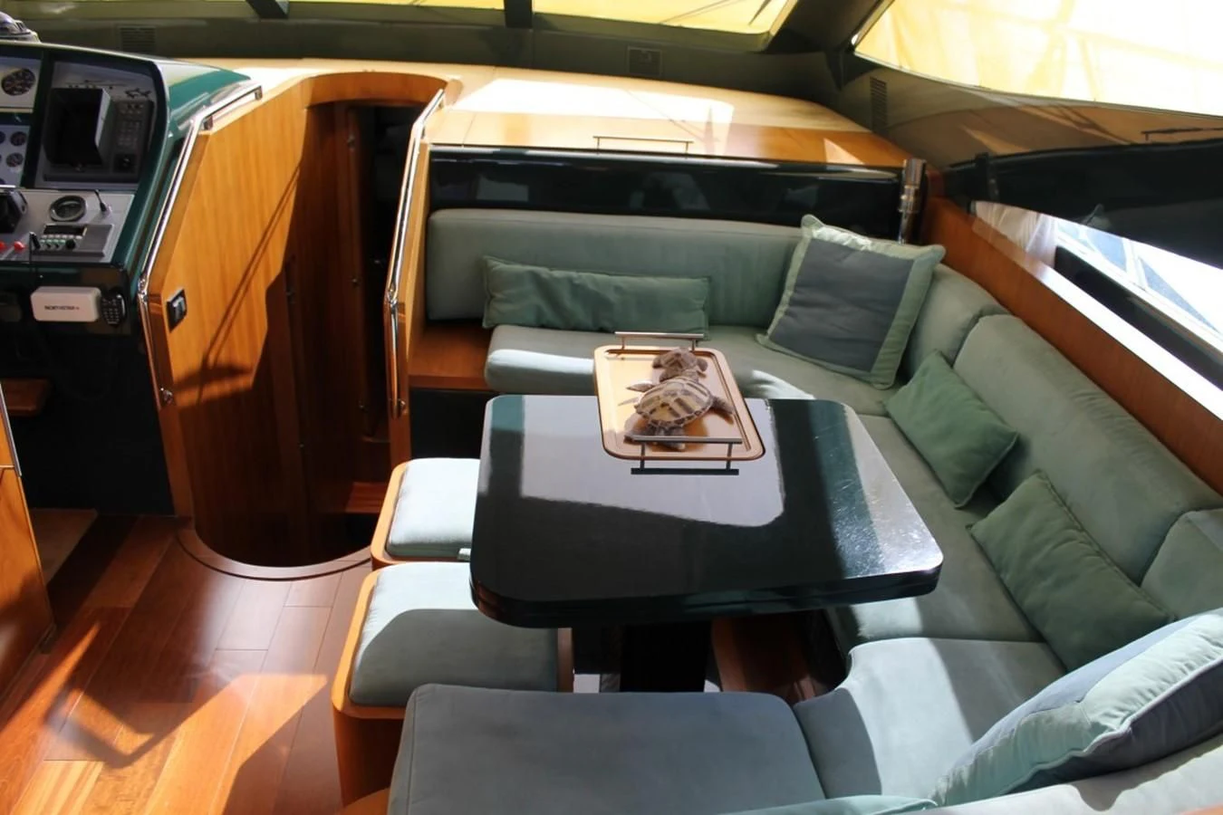 a car with a table and chairs aboard MACAMI Yacht for Sale