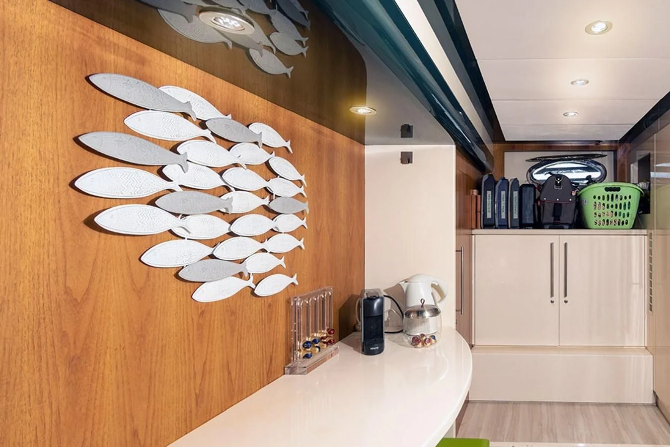 a room with a table and a fan aboard MACAMI Yacht for Sale